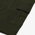 The Board Shorts in khaki — close-up of the side pocket with drainage eyelet