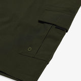 The Board Shorts in khaki — close-up of the side pocket with drainage eyelet