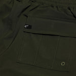 The Board Shorts in khaki — close-up of the back flap pocket and drainage eyelet