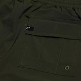 The Board Shorts in khaki — close-up of the back flap pocket and drainage eyelet