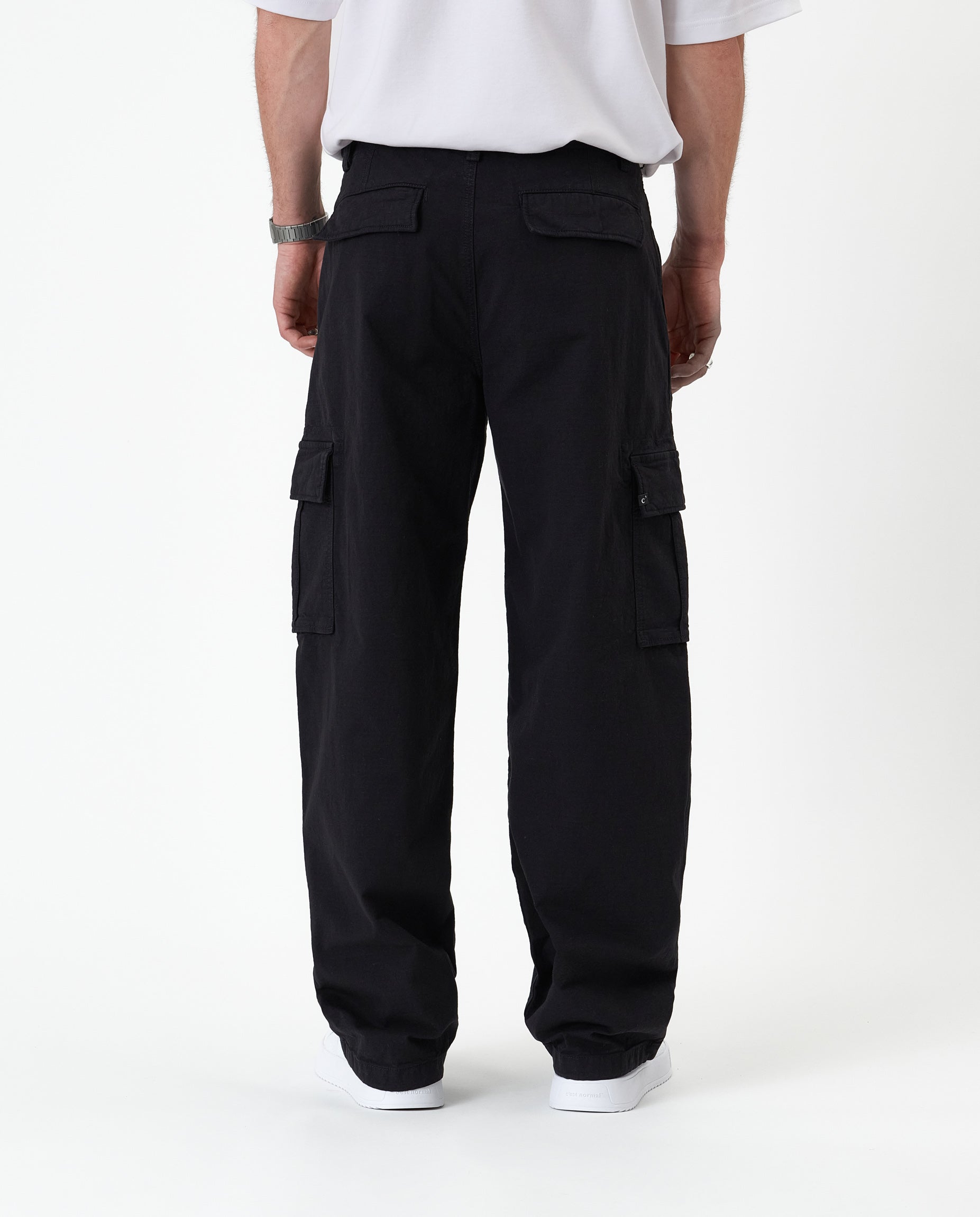The Monterey Cargo Pant in black — back view showing the cargo pockets and relaxed fit
