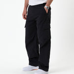 The Monterey Cargo Pant in black — side view showing the cargo flap pocket