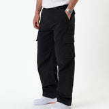 The Monterey Cargo Pant in black — side view showing the cargo flap pocket