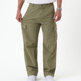The Monterey Cargo Pant in Light Khaki — model pulling the fabric to show the comfort stretch