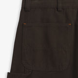 The Carpenter Pants in brown — close-up of the back pocket and hammer loop