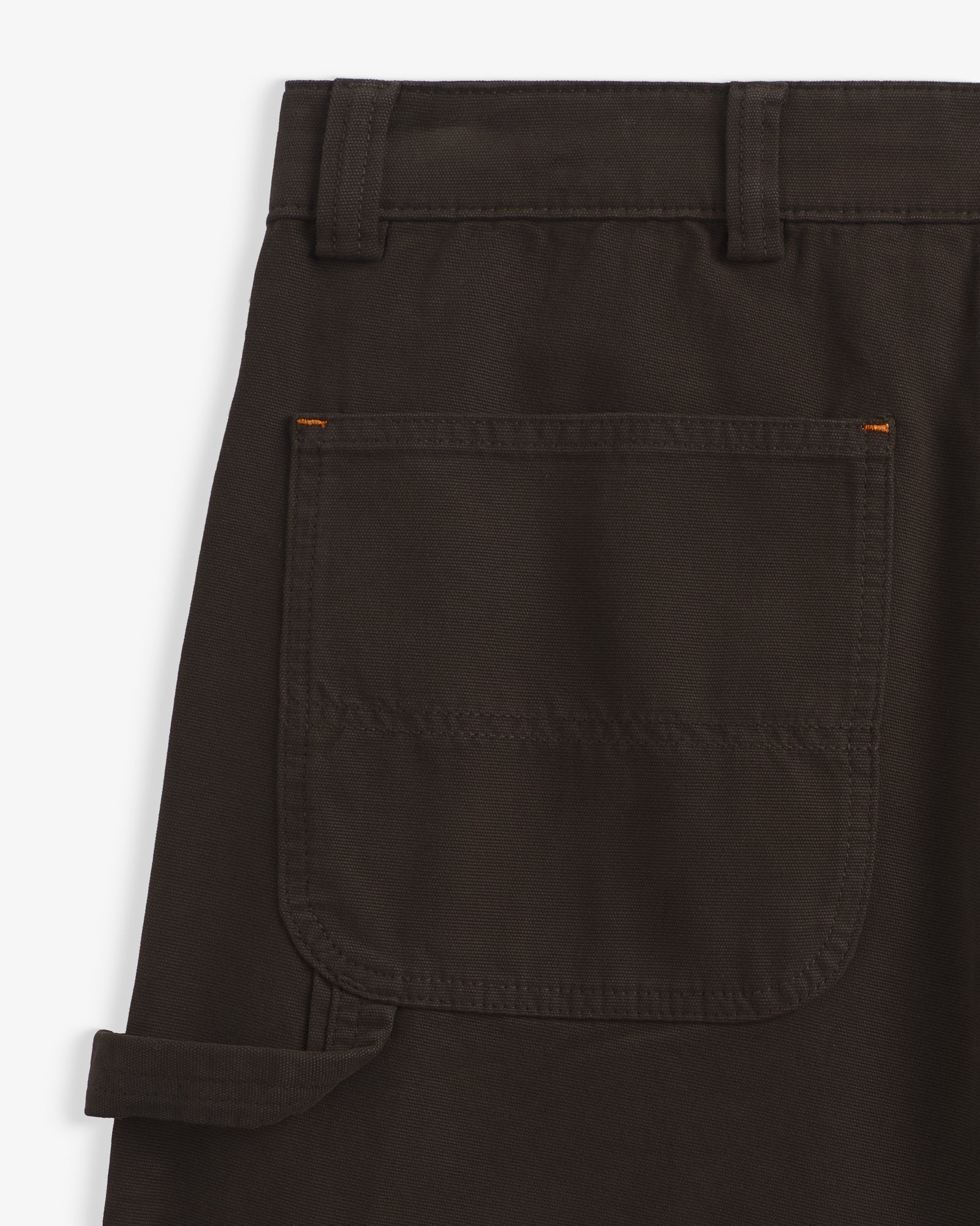The Carpenter Pants in brown — close-up of the back pocket and hammer loop
