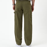 The Carpenter Pant in olive green — back view showing utility pockets and a hammer loop
