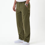 The Carpenter Pant in olive green — side view showing the double knee paneling
