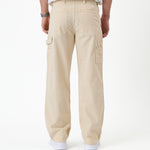 The Carpenter Pant in sand — back view with utility pockets and hammer loop