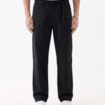 The Chamonix Chino in black — front view showing the integrated belt and relaxed fit