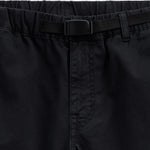 The Chamonix Chino in black — close-up of the waistband and integrated belt buckle
