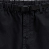 The Chamonix Chino in black — close-up of the waistband and integrated belt buckle