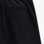 The Chamonix Chino in black — close-up of the back pocket and waistband