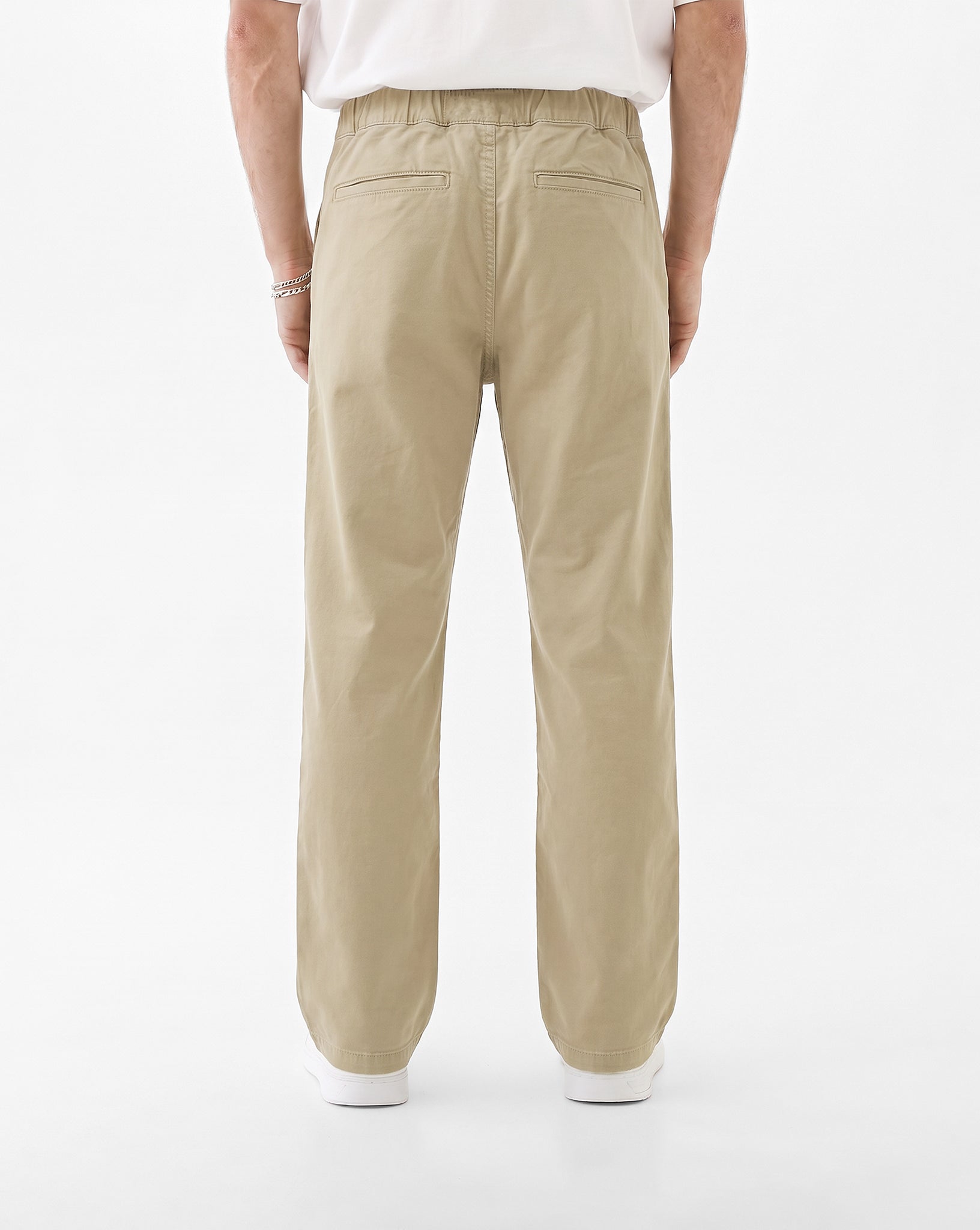 The Chamonix Chino in khaki beige — back view showing the pockets and elastic waistband