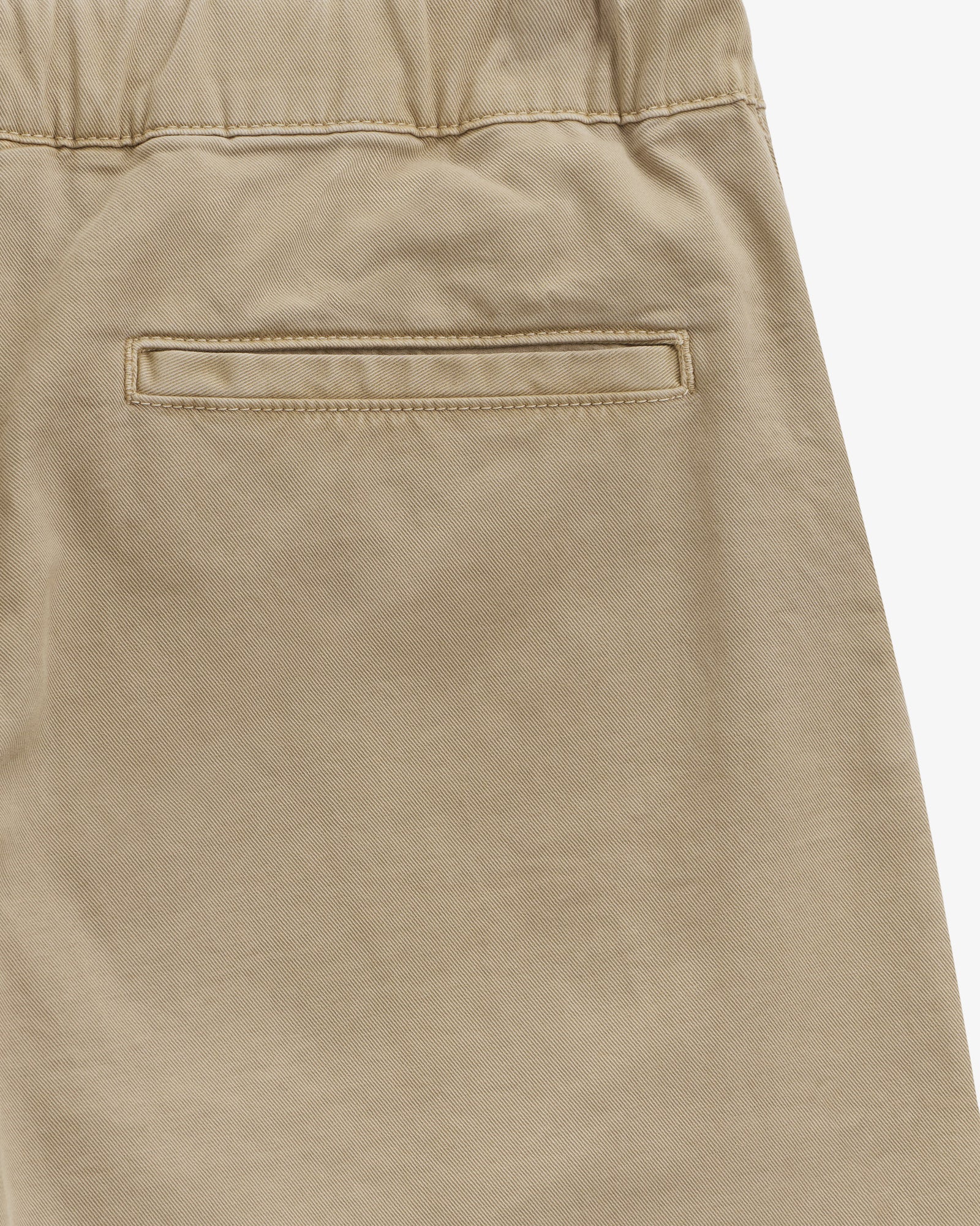 The Chamonix Chino in khaki — close-up of the back welt pocket and elastic waistband