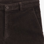 The Daily Cord Chino in chocolate — close-up of the waistband and pocket