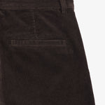 The Daily Cord Chino in chocolate — close-up of the back pocket and corduroy texture