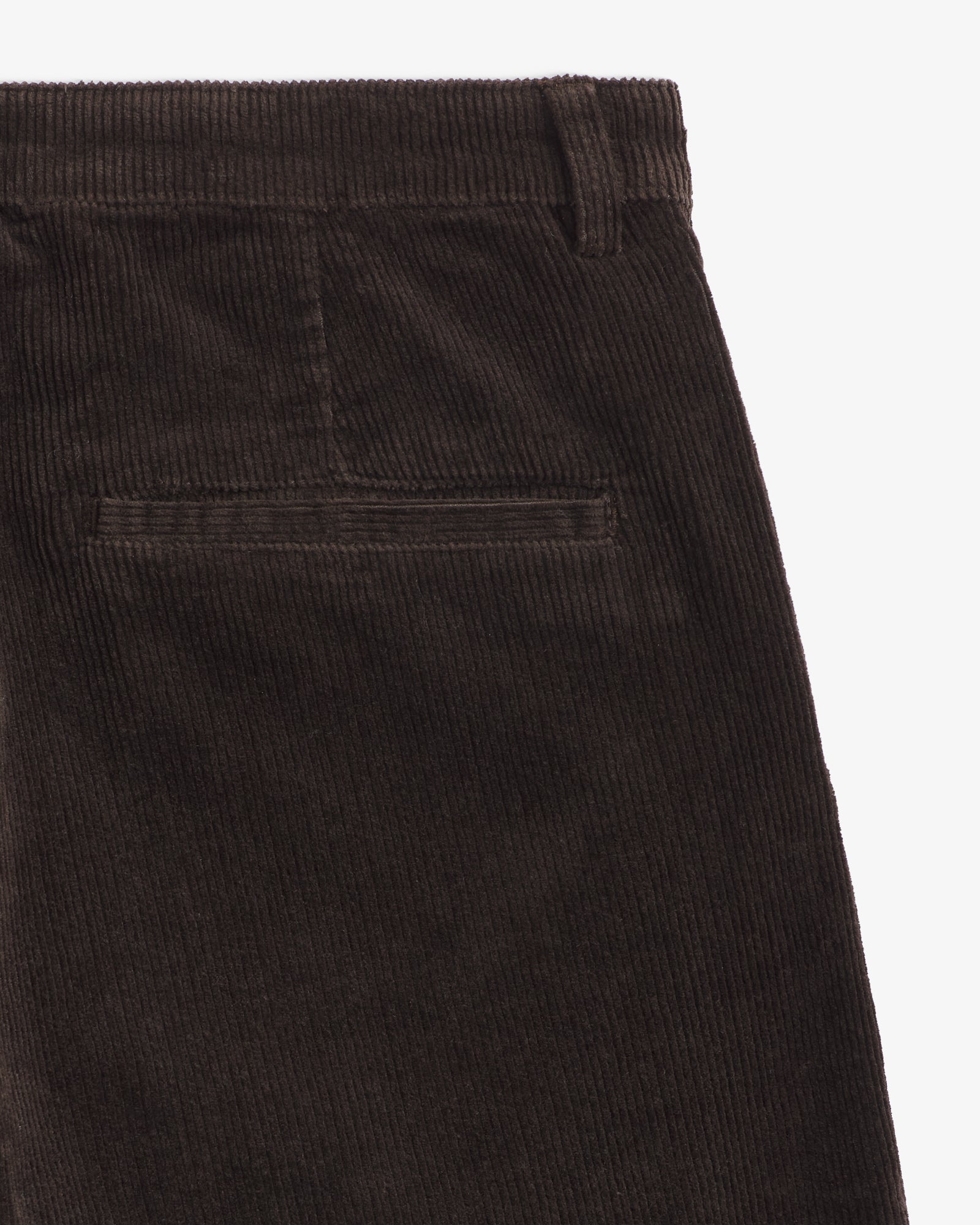 The Daily Cord Chino in chocolate — close-up of the back pocket and corduroy texture