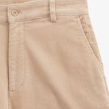The Daily Cord Chino in irish cream — close-up of the waistband and pocket detail