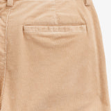 The Daily Cord Chino in Irish cream — close-up of the buttoned rear pocket