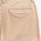 The Daily Cord Chino in irish cream — close-up of the rear pocket and corduroy texture