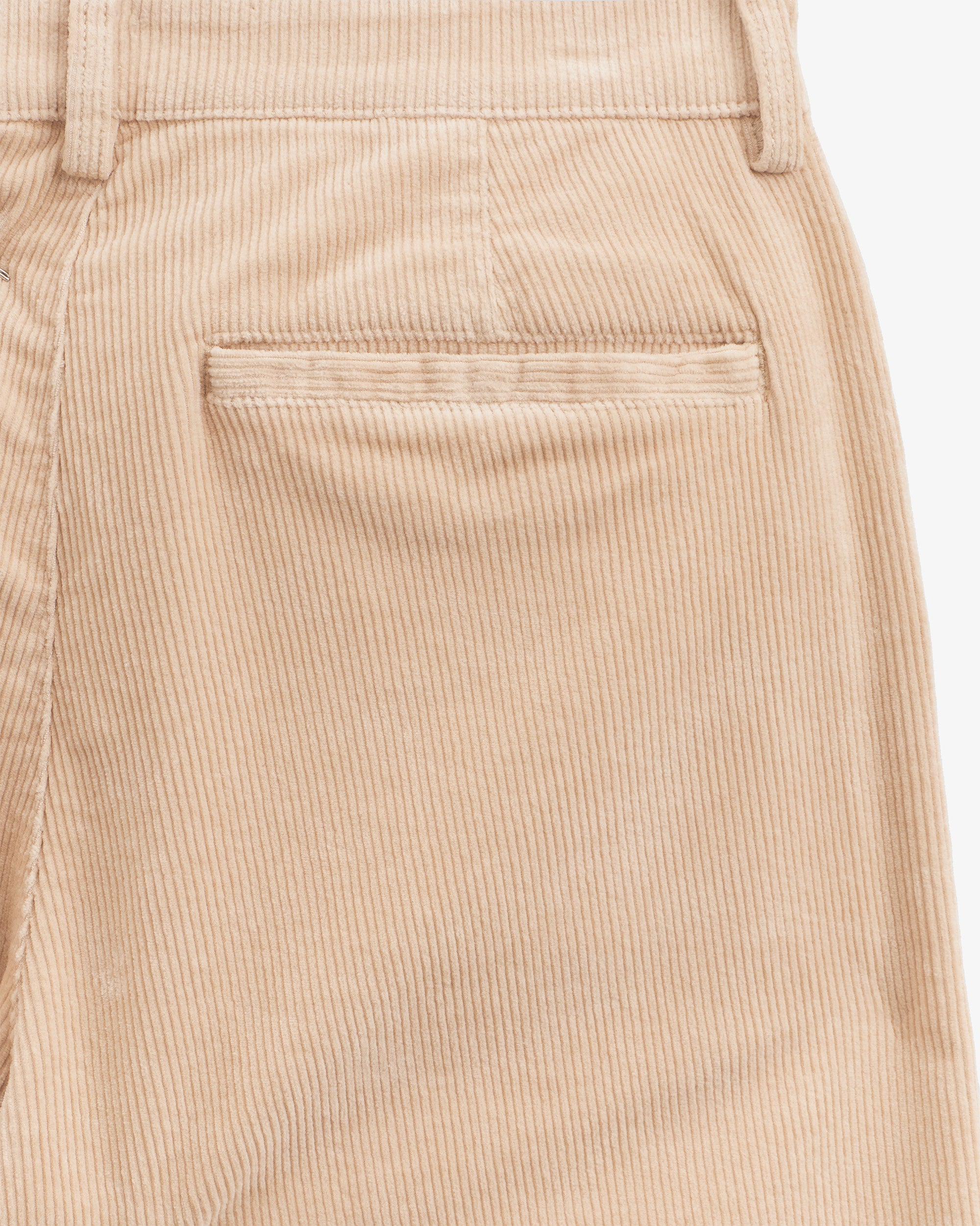The Daily Cord Chino in irish cream — close-up of the rear pocket and corduroy texture