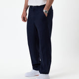 The Daily Linen Trouser in navy — side view showing the straight leg silhouette