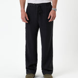 The Holiday Linen Trouser in black — front view with a drawstring waist