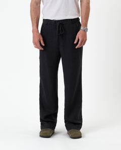 The Holiday Linen Trouser in black — front view with a drawstring waist