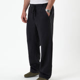 The Holiday Linen Trouser in black — front view against a white background