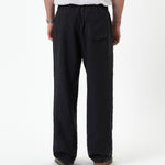 The Holiday Linen Trouser in black — back view against a white background