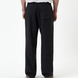 The Holiday Linen Trouser in black — back view against a white background