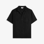 The Holiday Linen Resort Shirt in black — front view with a camp collar and chest pocket