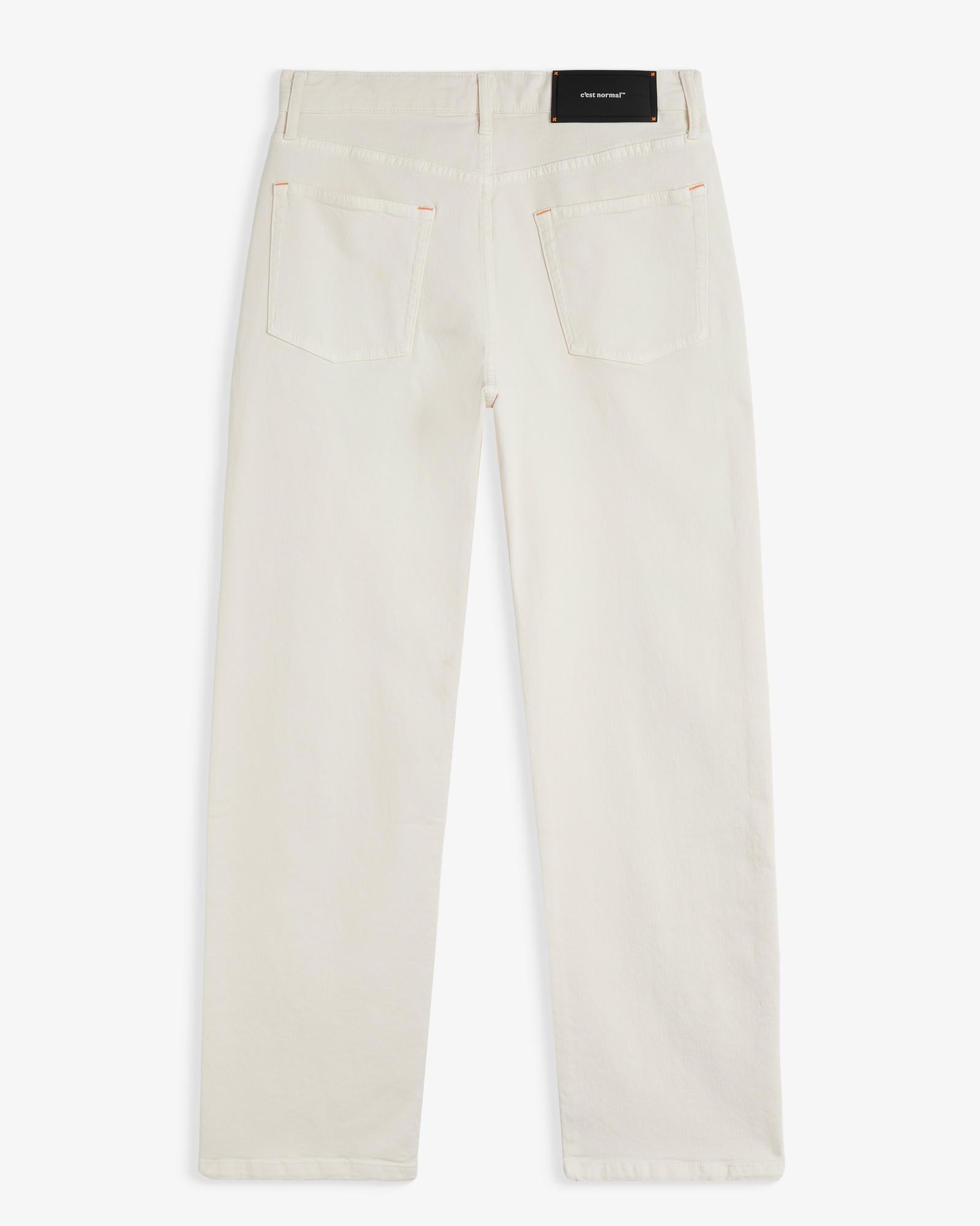 The Jeans Relaxed Straight Fit in ecru — back view with the black C'est normal rubber patch