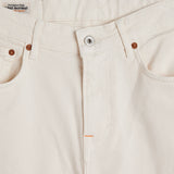 The Jeans Relaxed Straight Fit in ecru — close-up of the front button closure and rivets