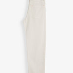 The Jeans Relaxed Straight Fit in ecru — folded back view with the C'est normal rubber patch