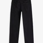 The Jeans Relaxed Straight Fit in Jet Black — back view with the C'est normal rubber patch