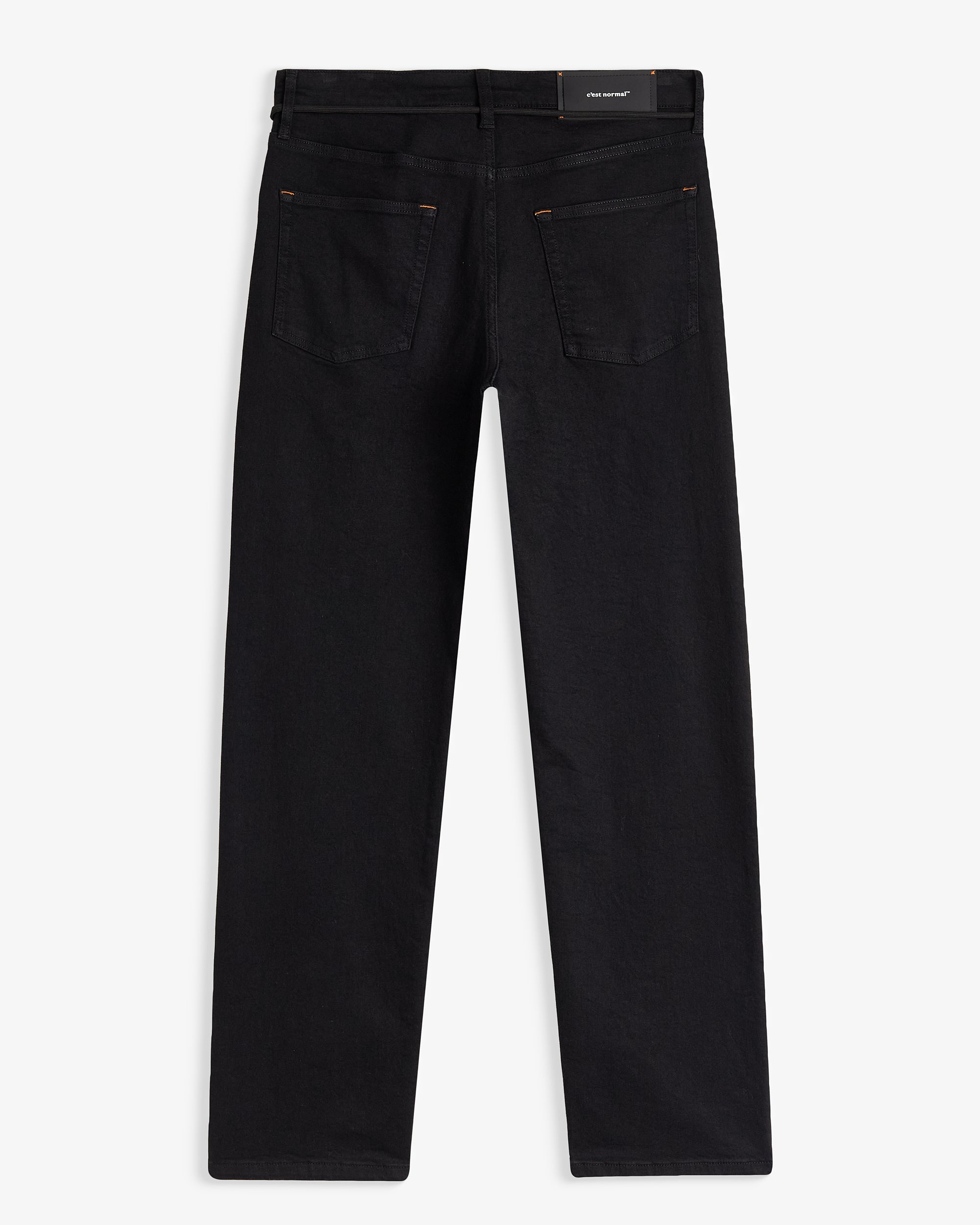 The Jeans Relaxed Straight Fit in Jet Black — back view with the C'est normal rubber patch