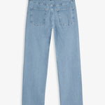 The Jeans Relaxed Straight Fit in light blue — back view with the black C'est normal rubber patch