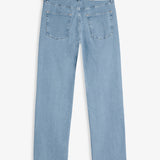 The Jeans Relaxed Straight Fit in light blue — back view with the black C'est normal rubber patch