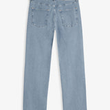 The Jeans Relaxed Straight Fit in Light Blue — back view with black C'est normal rubber patch