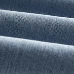 The Jeans Relaxed Straight Fit in light blue — close-up of the Motion Fabric texture