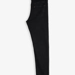 The Jeans Slim Fit in Jet Black, folded in half and laid flat on a white background. The image highlights the back pocket, subtle orange accent stitching, and the rubber patch with the c'est normal logo at the back waist.