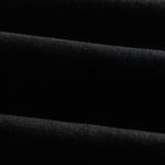 A close-up shot of the jet black Motion Fabric of The Jeans Slim Fit by c'est normal, highlighting its texture.