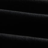 A close-up shot of the jet black Motion Fabric of The Jeans Slim Fit by c'est normal, highlighting its texture.