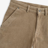 The Lille Cord Carpenter Pant in dark sand — close-up of the waistband and corduroy texture