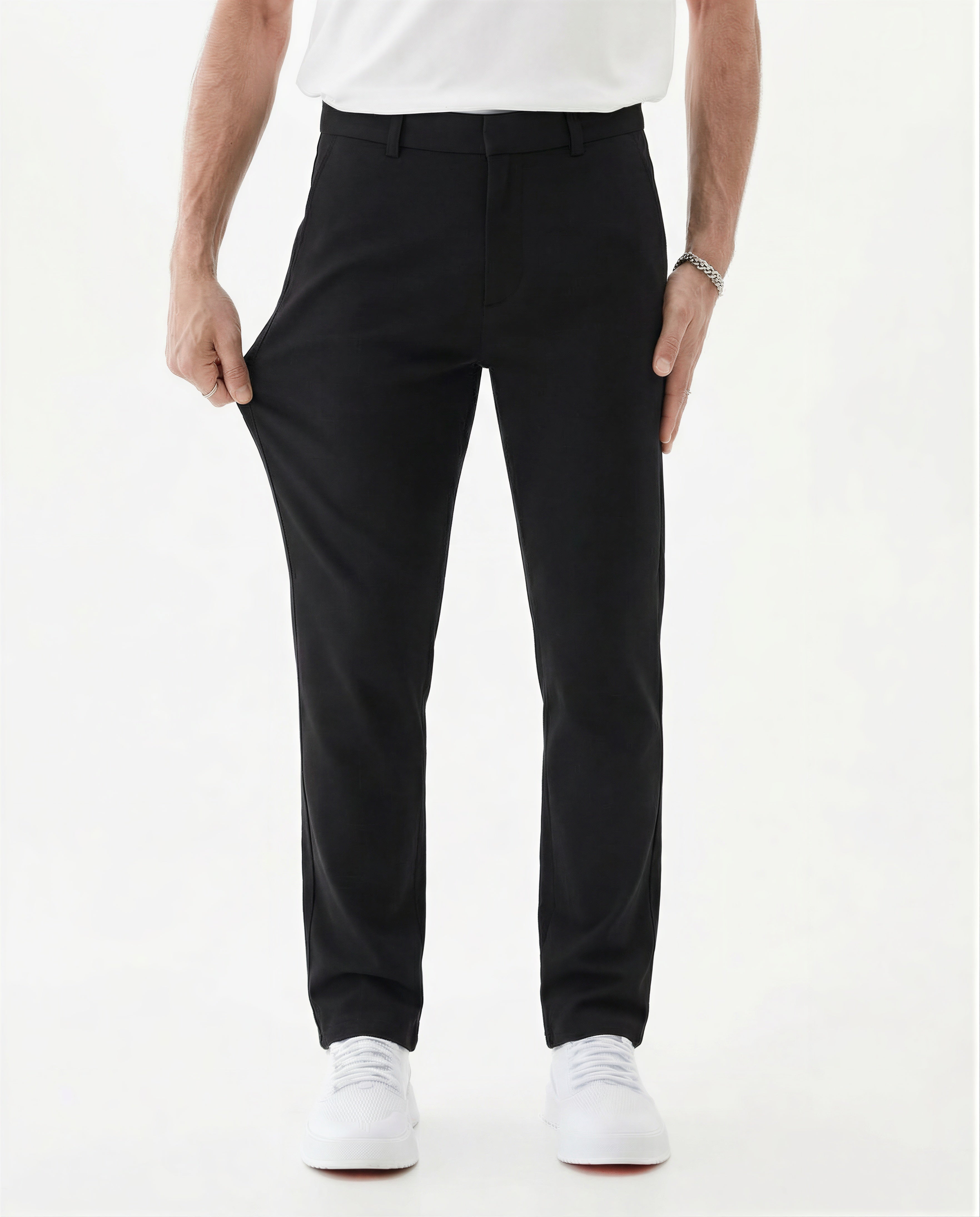 The Proper Pant Classic Straight Fit in black — model stretching the fabric