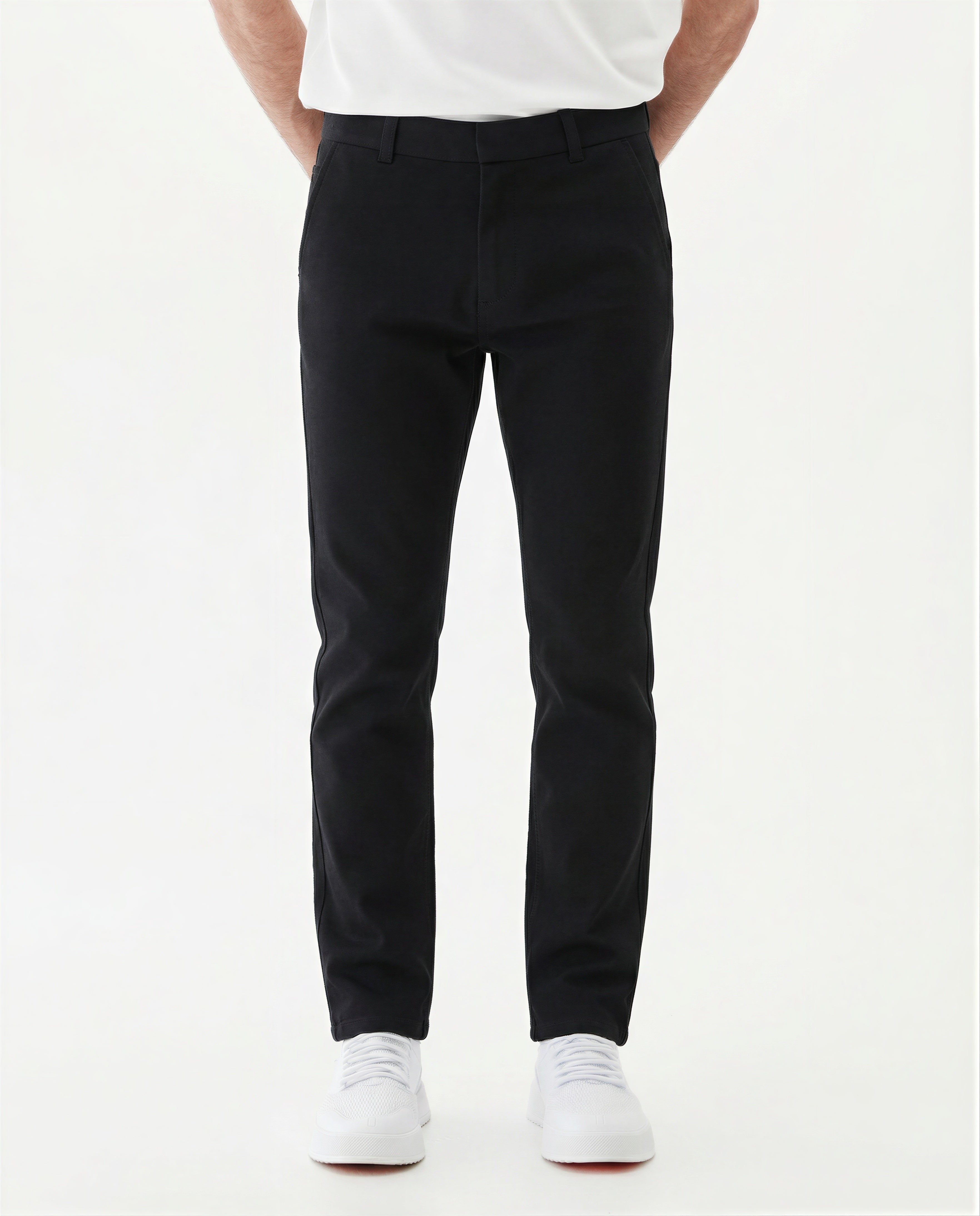 The Proper Pant Classic Straight Fit in black — worn with white sneakers.