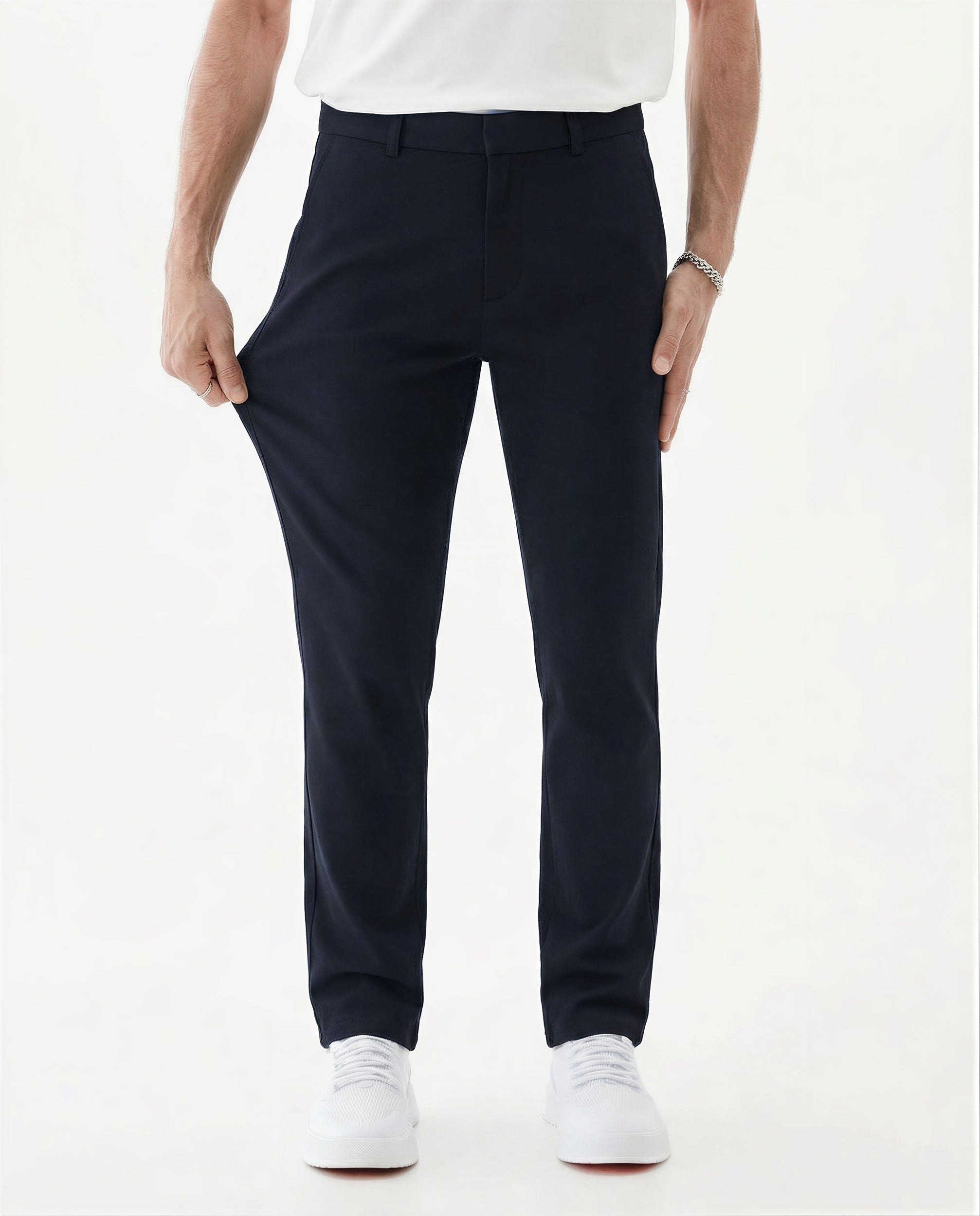 The Proper Pant Classic Straight Fit in navy — model pulling the fabric to show stretch