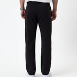 The Proper Pant Regular Fit in black — back view showing the rear welt pockets